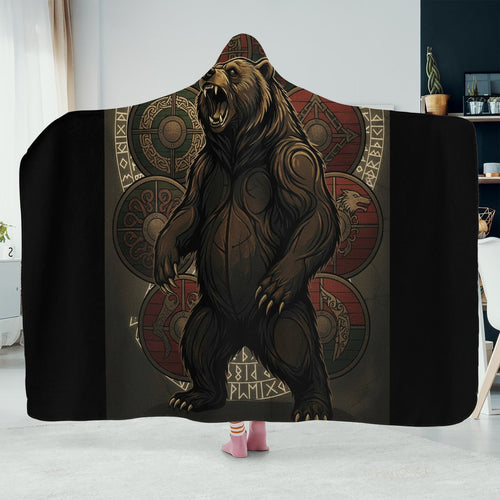 Hooded blanket with bear design and geometric patterns on a plain background